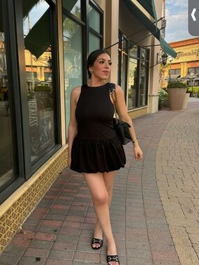 Black Sleeveless Mini Dress with Ruffled Skirt